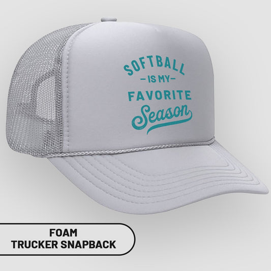 White foam trucker snapback hat with teal text "Softball is my favorite season".