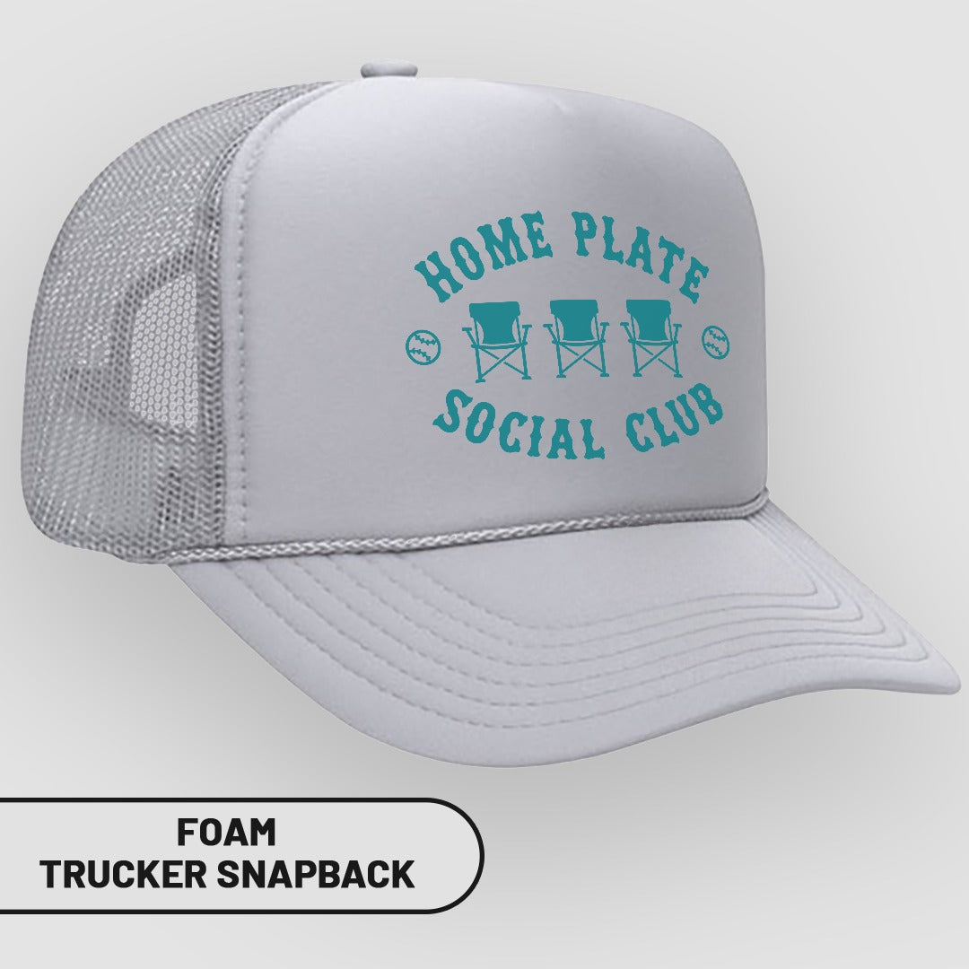 White foam trucker snapback hat with "HOME PLATE SOCIAL CLUB" text and chairs.